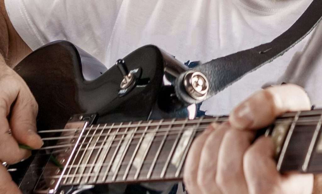 Guitar fretboard being played