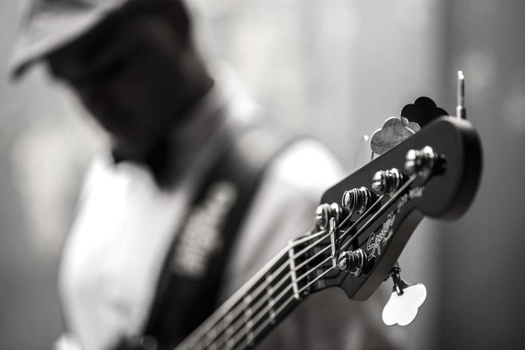 Person playing 5-String Bass Guitar