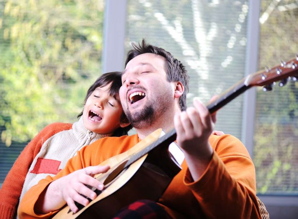 Dad and son singing "Joy to the World"