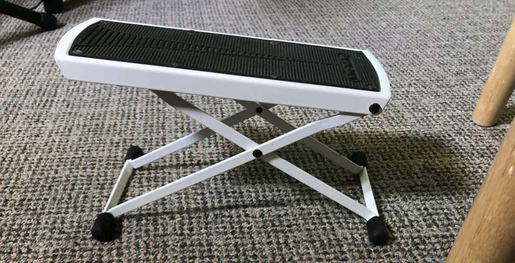 Guitar foot stool or foot rest used to raise one leg for playing guitar