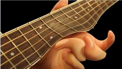 guitar fretboard with hand